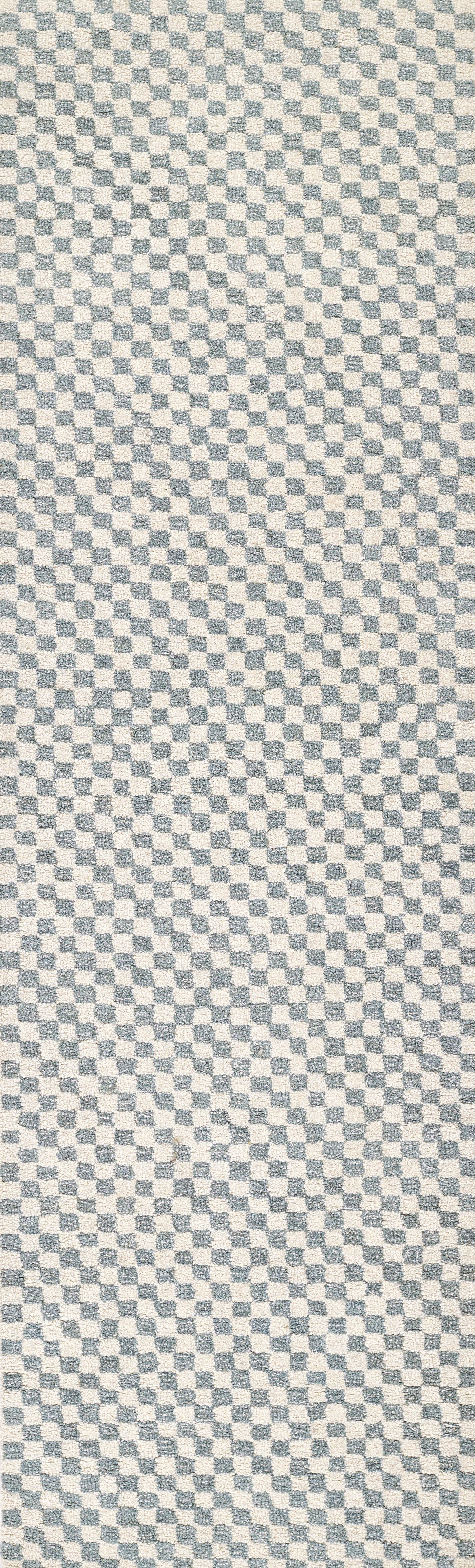 Close-up of blue and beige checkerboard woven textile with small square pattern, suitable for rug or upholstery.