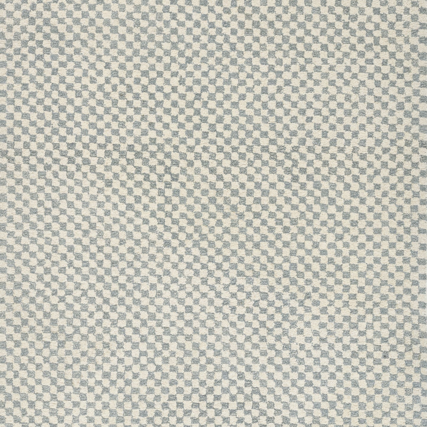 Close-up of blue and beige micro-check woven fabric texture.