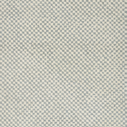 Close-up of blue and beige micro-check woven fabric texture.