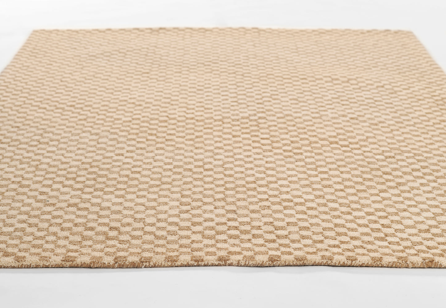 Beige tan low-pile rug with a subtle checkerboard pattern & fringed edges, rectangular living-room rug.