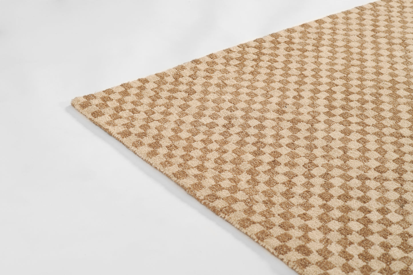 Tan and beige geometric diamond pattern rug with plush pile; rectangular living room accent.
