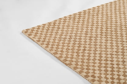 Tan and beige geometric diamond pattern rug with plush pile; rectangular living room accent.