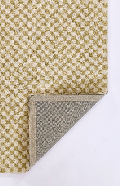 Olive-green and beige checkerboard woven rug with folded corner exposing beige edge and gray underside.