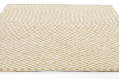 Beige textured rug with a subtle repeating rounded-dot pattern and neutral cream tones.
