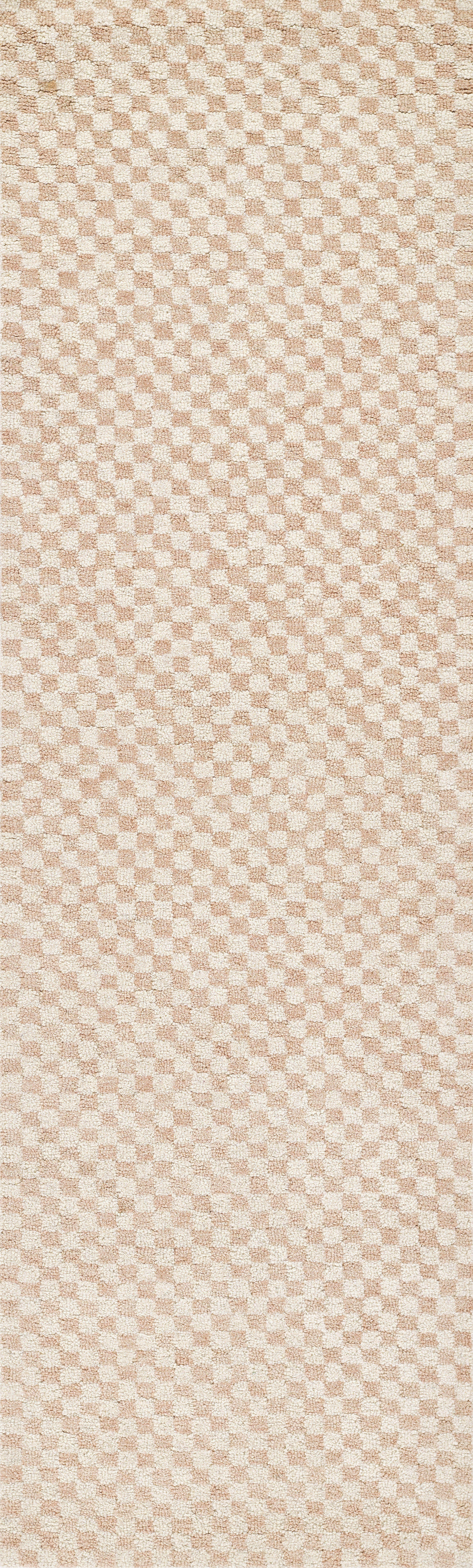 Beige and peach checkerboard rug with a soft woven texture; 8' x 10'.