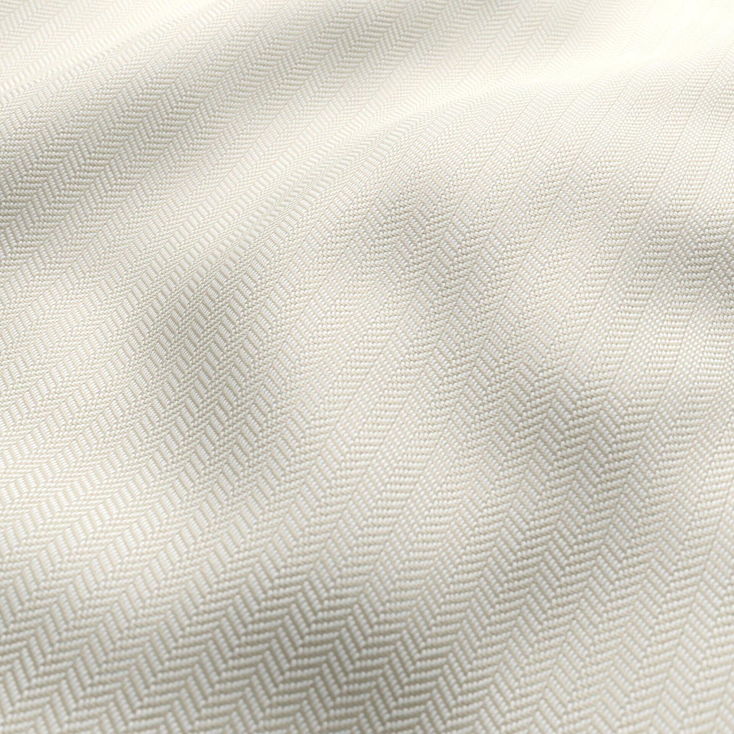 Ivory-beige chevron jacquard outdoor fabric with subtle woven texture and soft drape.