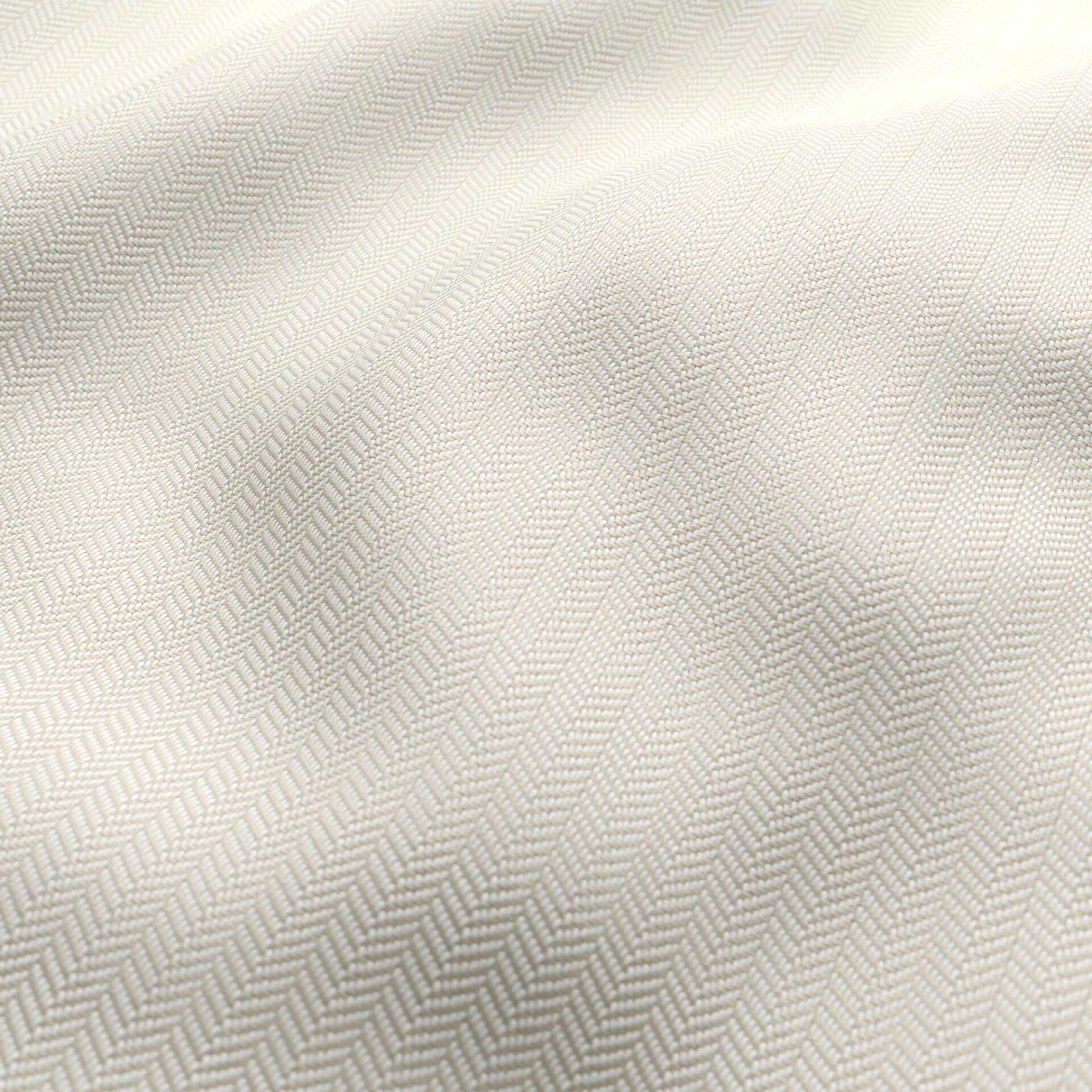 Ivory-beige chevron jacquard outdoor fabric with subtle woven texture and soft drape.