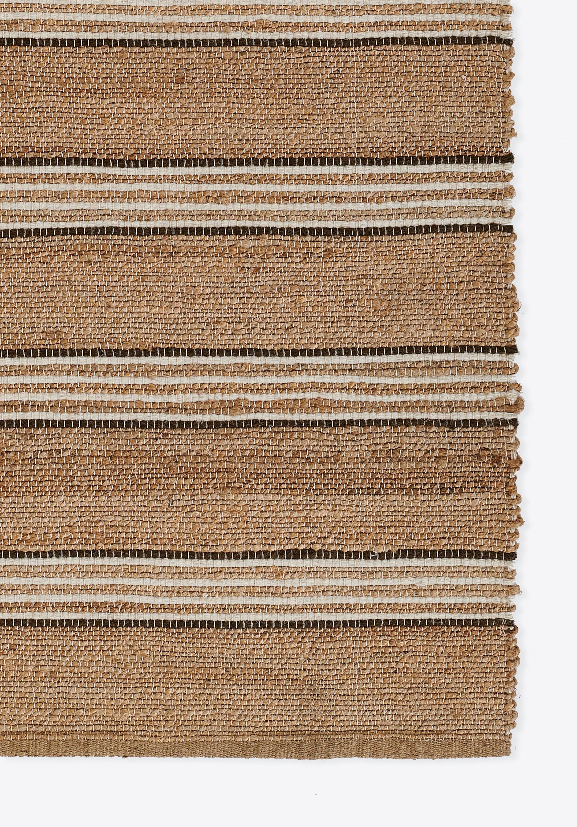 Natural jute rug with broad beige and brown stripes; woven texture, rectangular, casual coastal style.