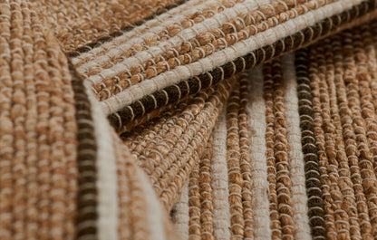 Natural brown and beige striped woven rug with chunky looped texture and jute-like fibers.