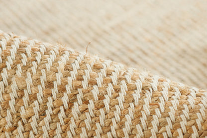 Natural beige raffia weave rug runner with white thread stripes; close-up of textured fibers (2' x 8').