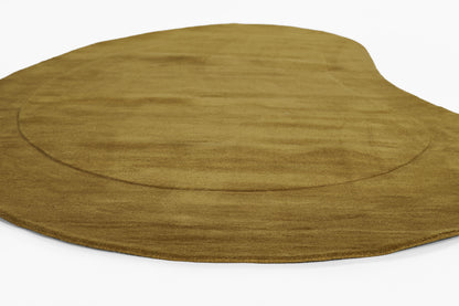 Warm brown rectangular rug with soft velvety pile and subtle circular ring detail.