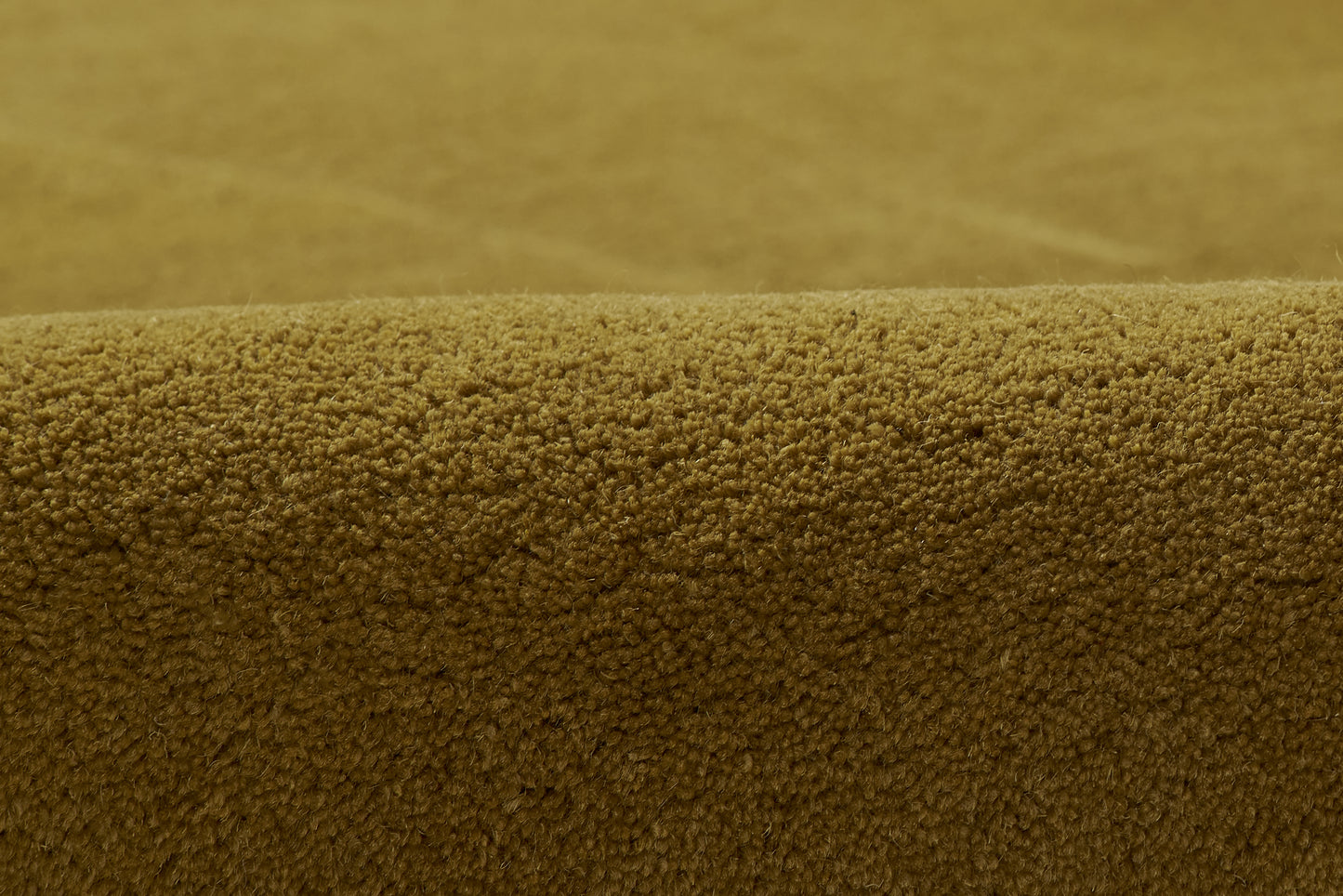 Close-up of warm brown boucle fabric with tiny looped pile texture