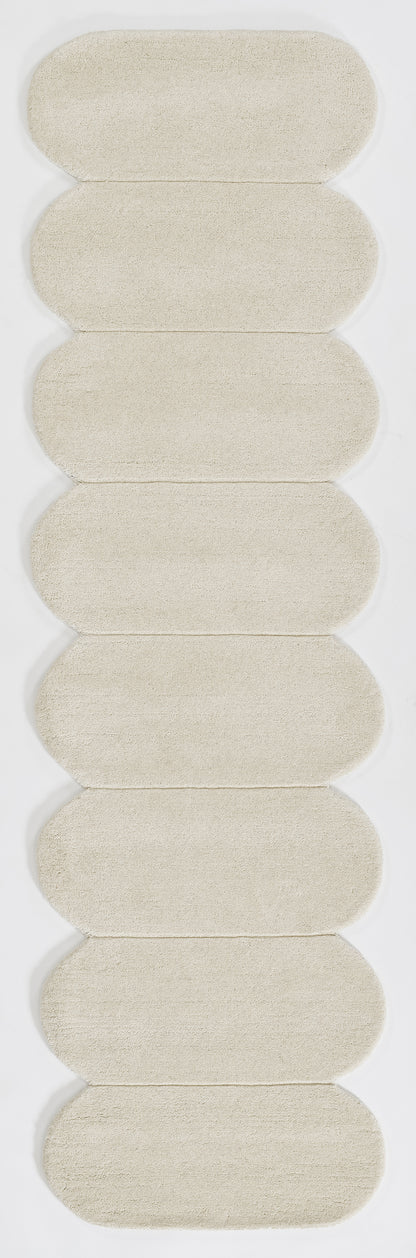 Pale beige rectangular rug with a soft, textured surface; size 9' x 12'.