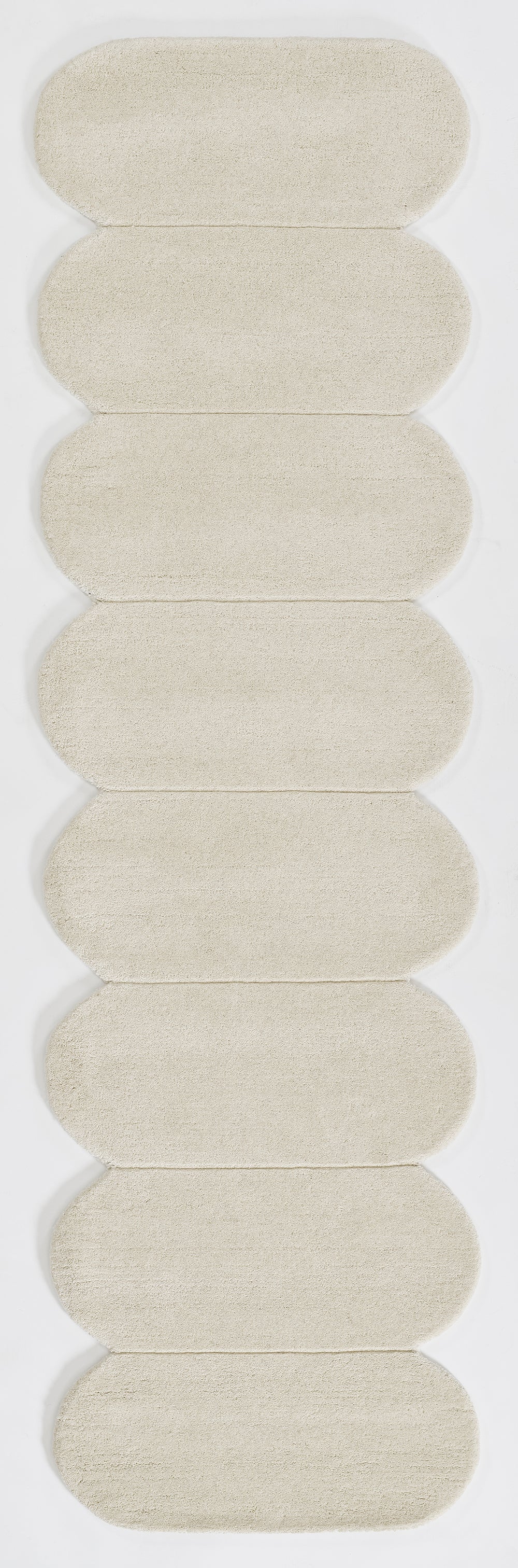 Beige rectangular rug with a woven texture.