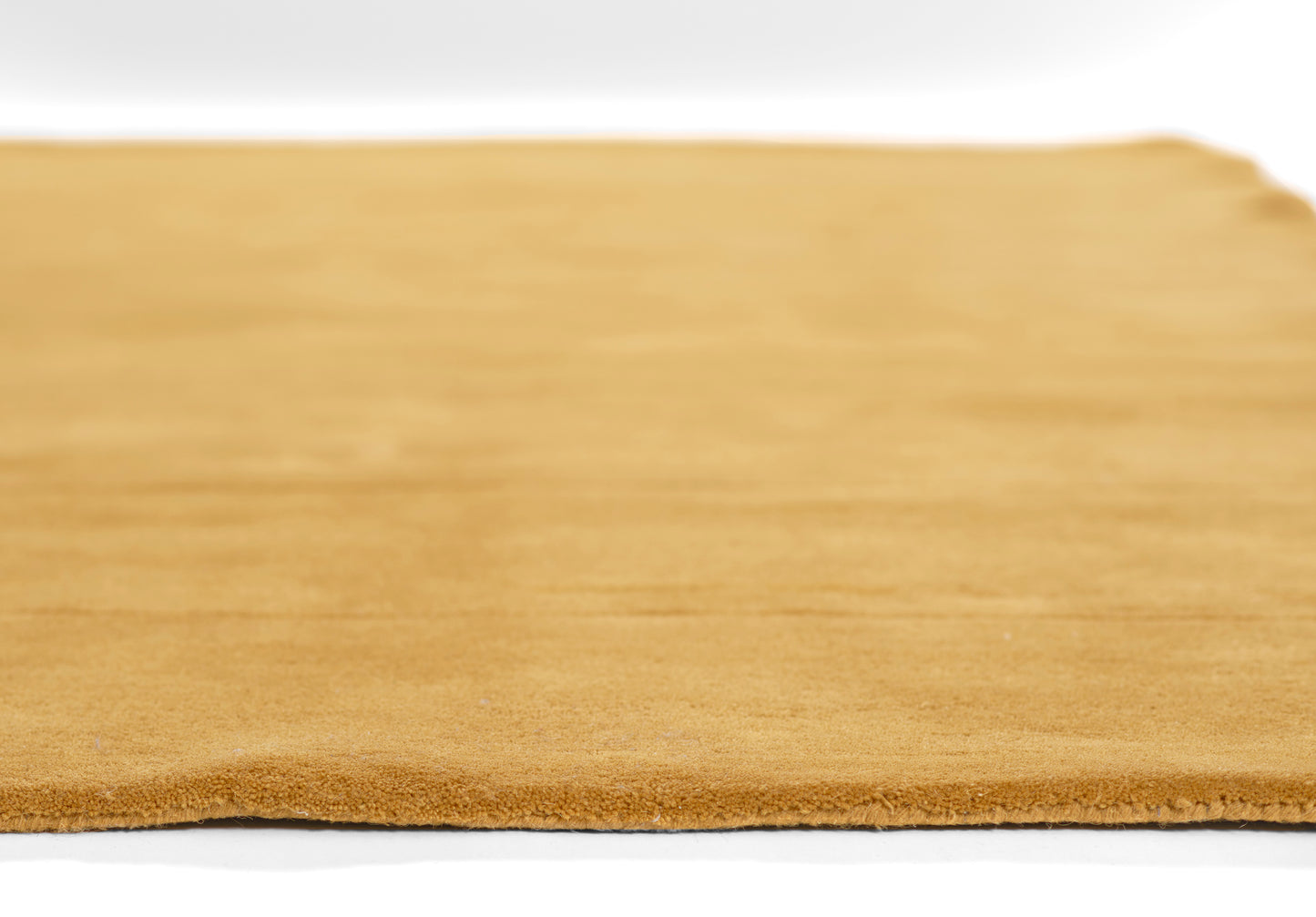 Tan rug, rectangular 8' x 10'.