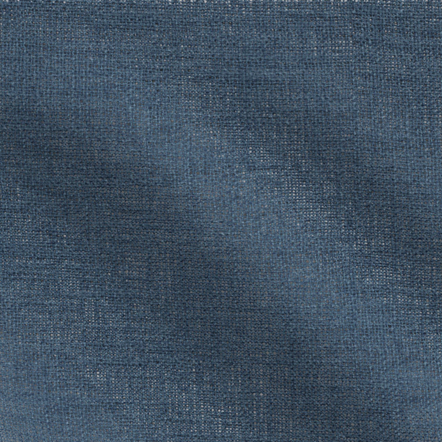 Close-up of navy blue plain fabric with visible weave and casual texture.