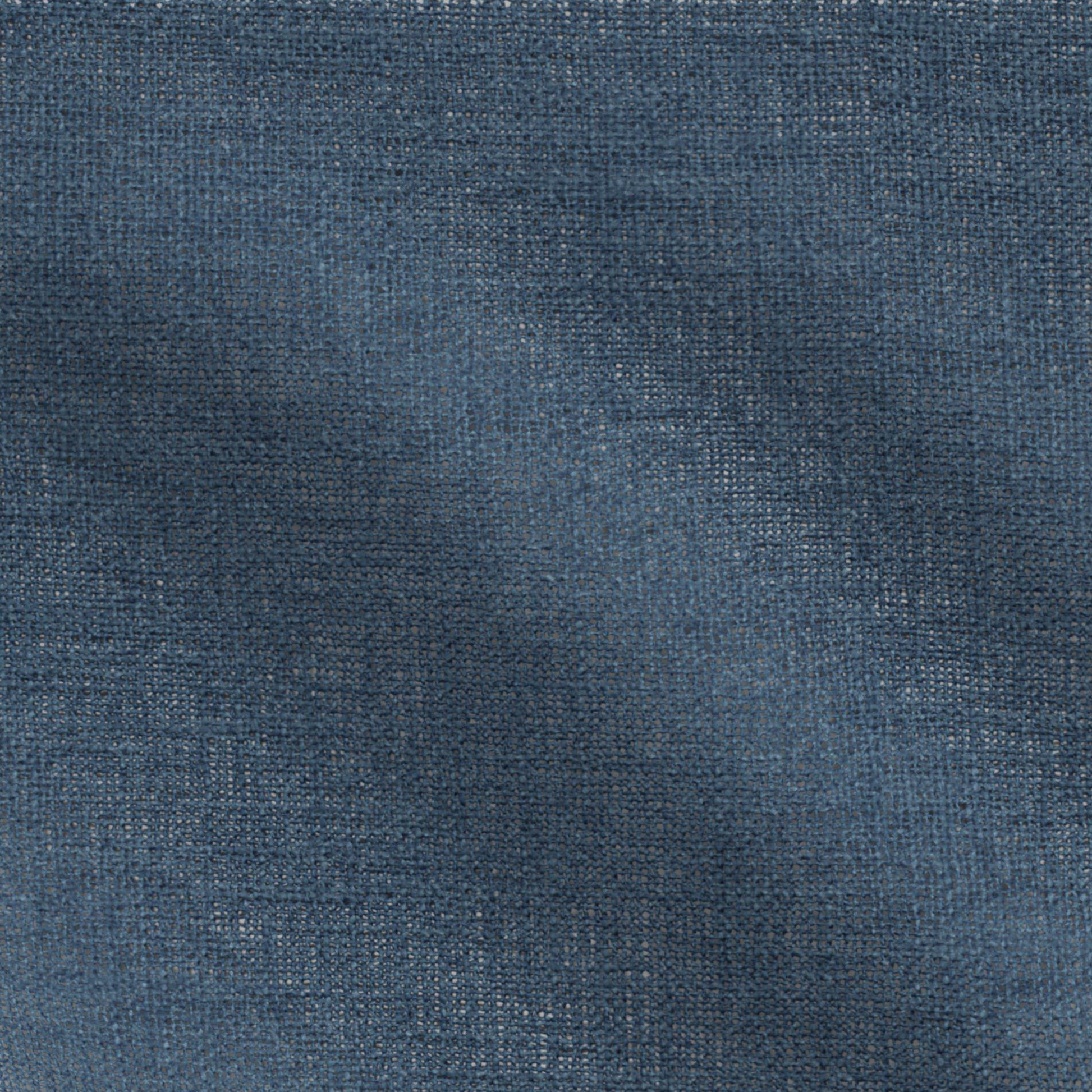 Close-up of navy blue plain fabric with visible weave and casual texture.