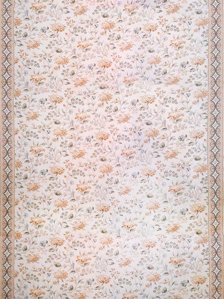 Cream floral fabric with peach blossoms and grey-green leaves; decorative border with geometric medallions, traditional style.