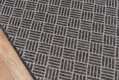 Gray geometric rug runner with interlocking square pattern and looped pile; neutral flooring.