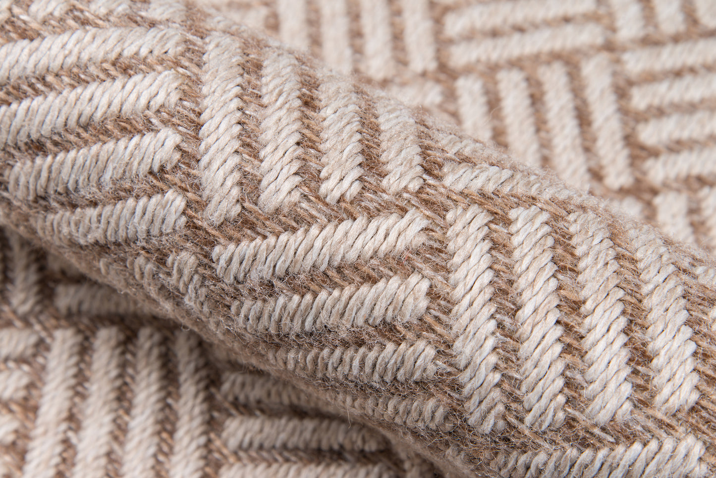 Beige & tan woven wool fabric with chevron pattern; thick textured textile ideal as a cozy throw blanket.