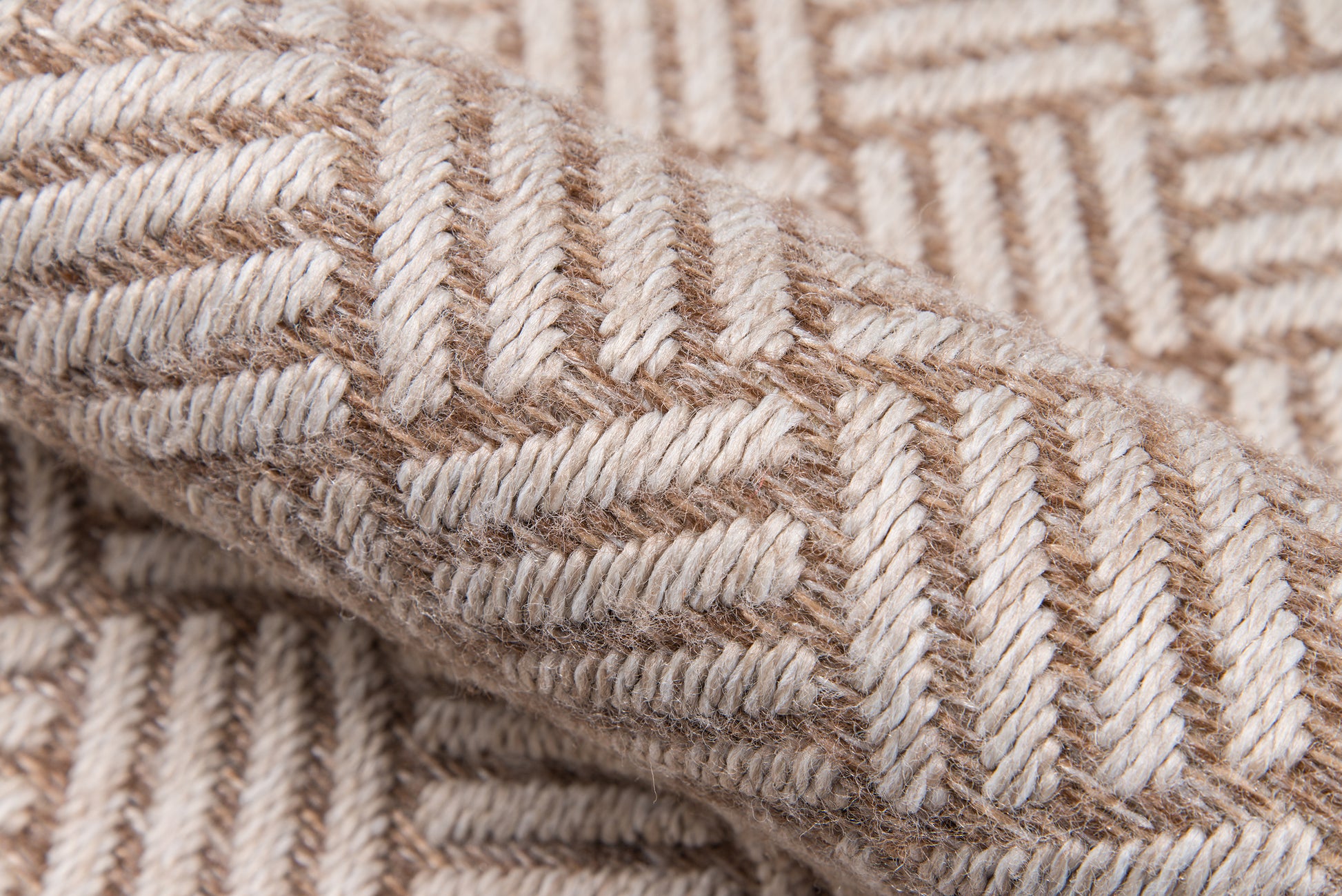 Beige & tan woven wool fabric with chevron pattern; thick textured textile ideal as a cozy throw blanket.