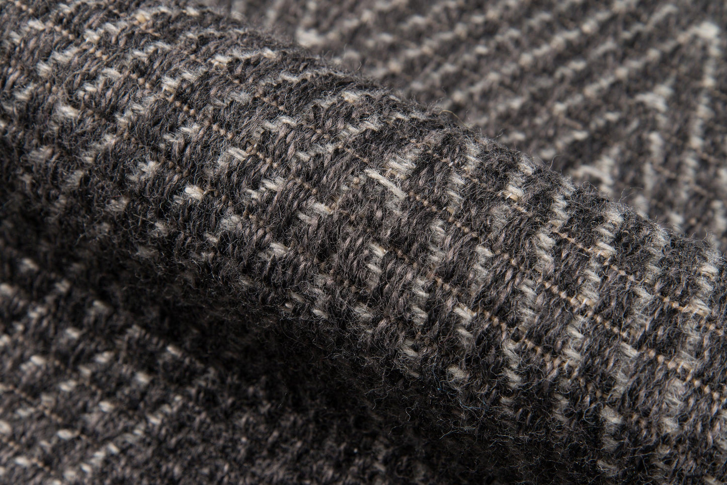 Charcoal gray tweed rug with white flecks; textured weave; 5' x 8' area rug.