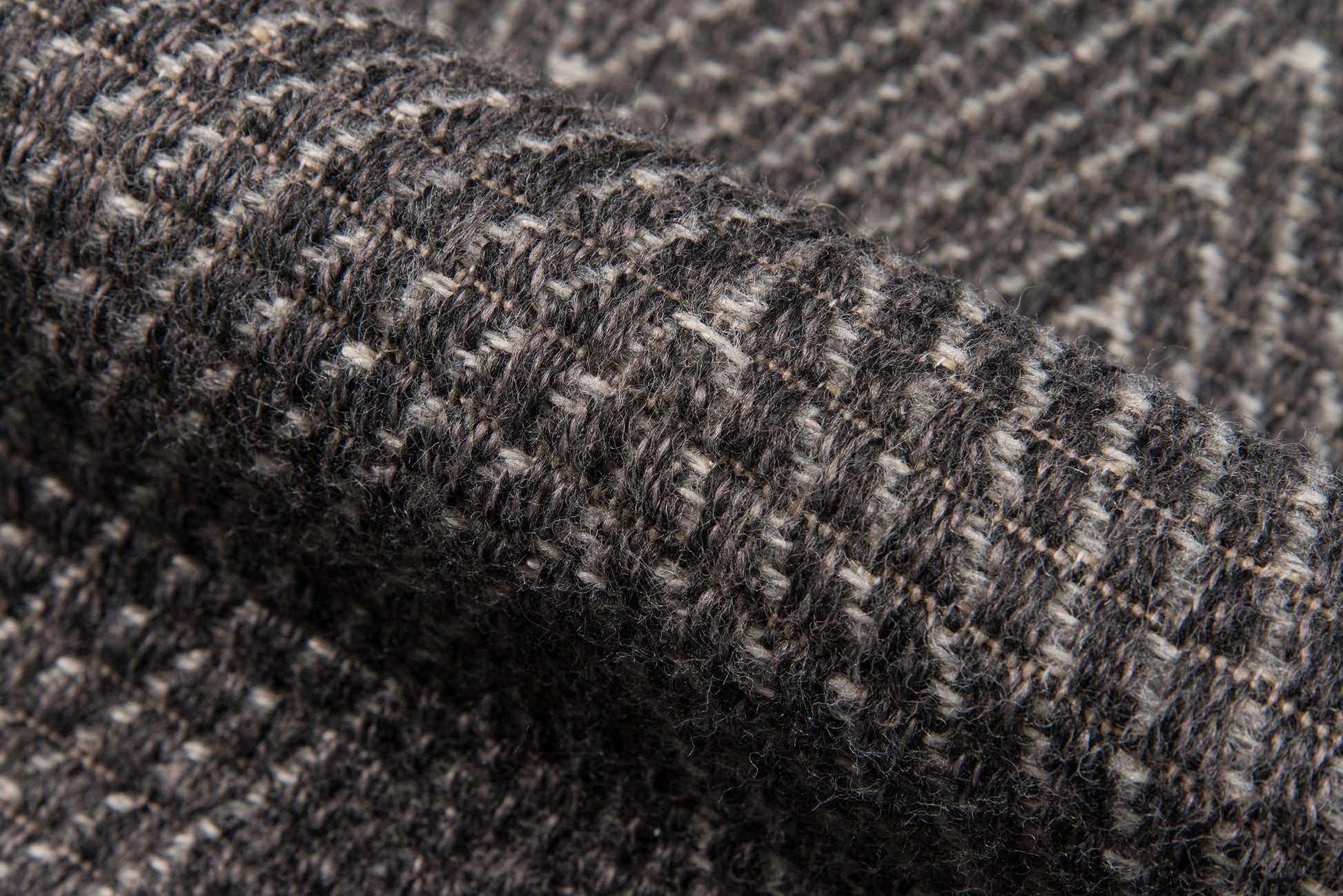 Charcoal gray tweed rug with white flecks; textured weave; 5' x 8' area rug.