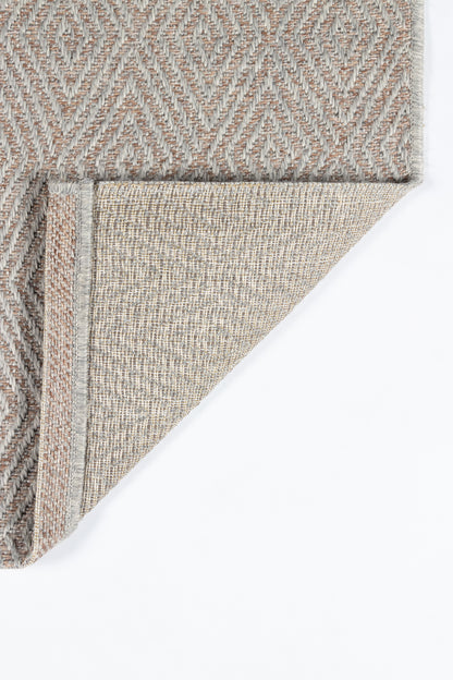 Beige and gray geometric woven rug with diamond motif; folded corner reveals light beige underside.