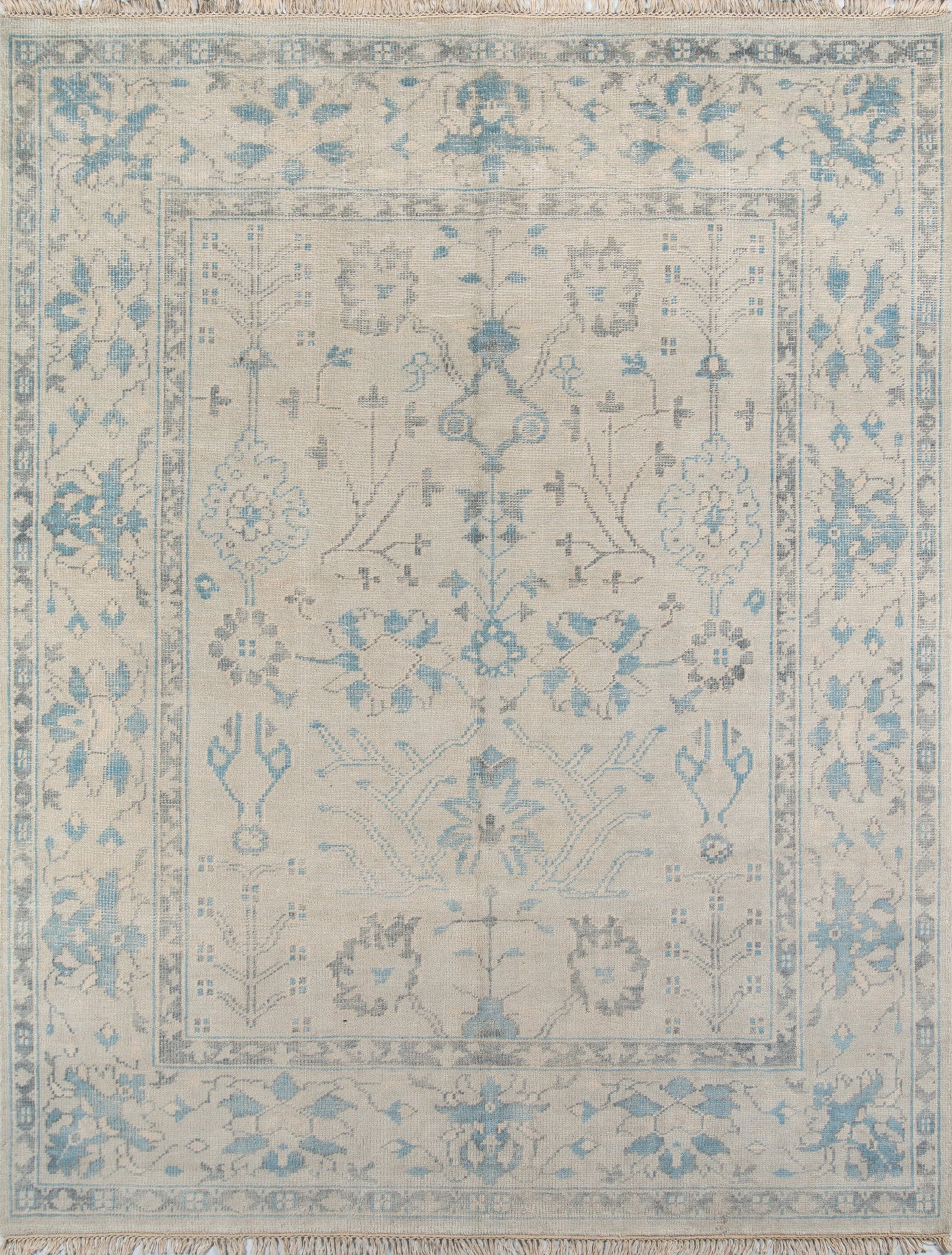 Ivory wool oriental rug with pale blue floral medallions, decorative border and fringed ends.
