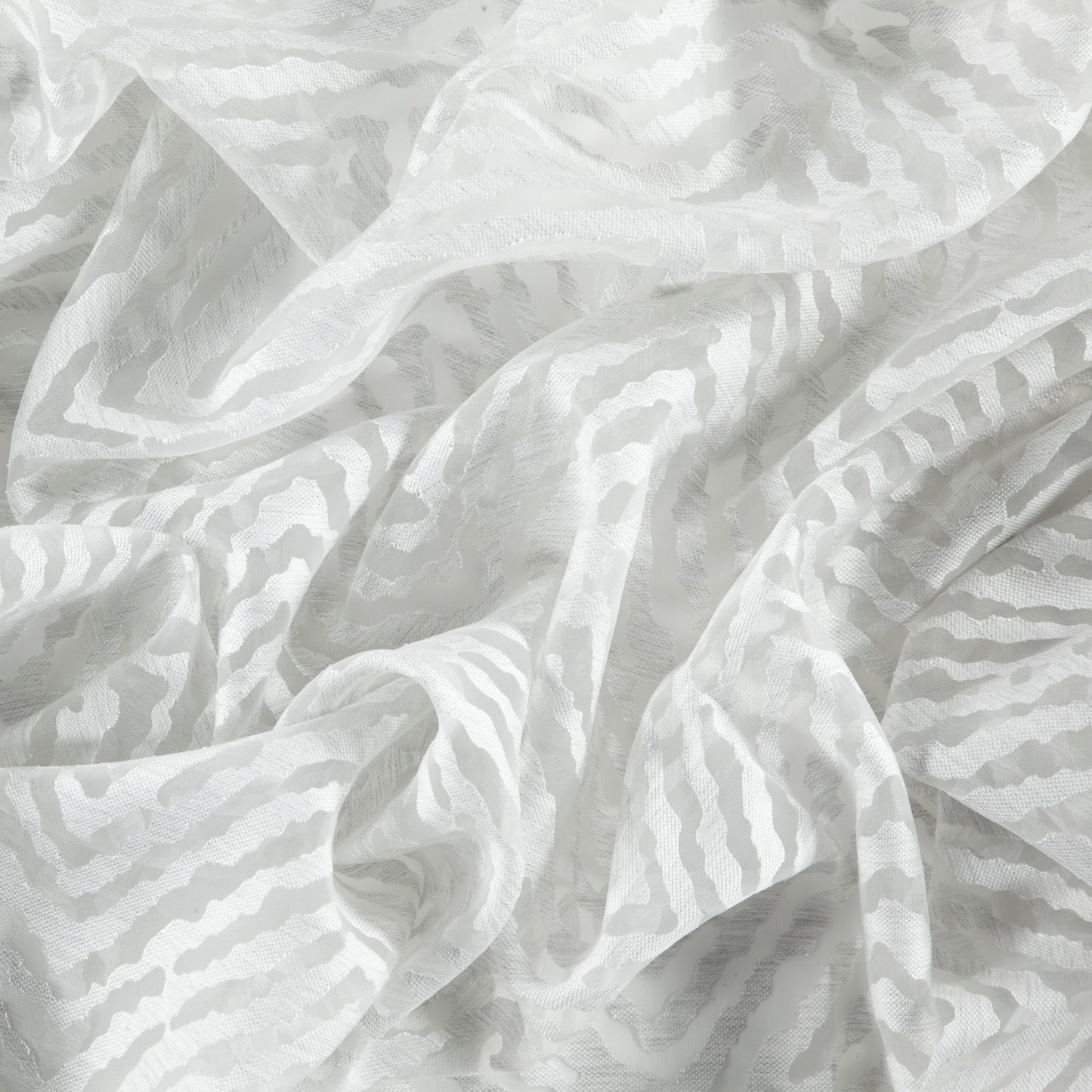 Gray sheer fabric with flamestitch and herringbone weave, soft drape and subtle texture.