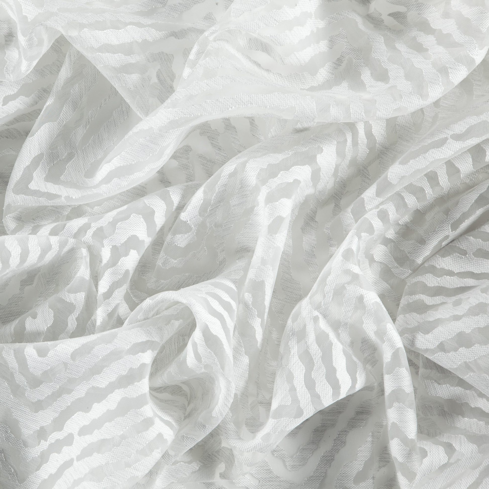 Gray sheer fabric with flamestitch and herringbone weave, soft drape and subtle texture.