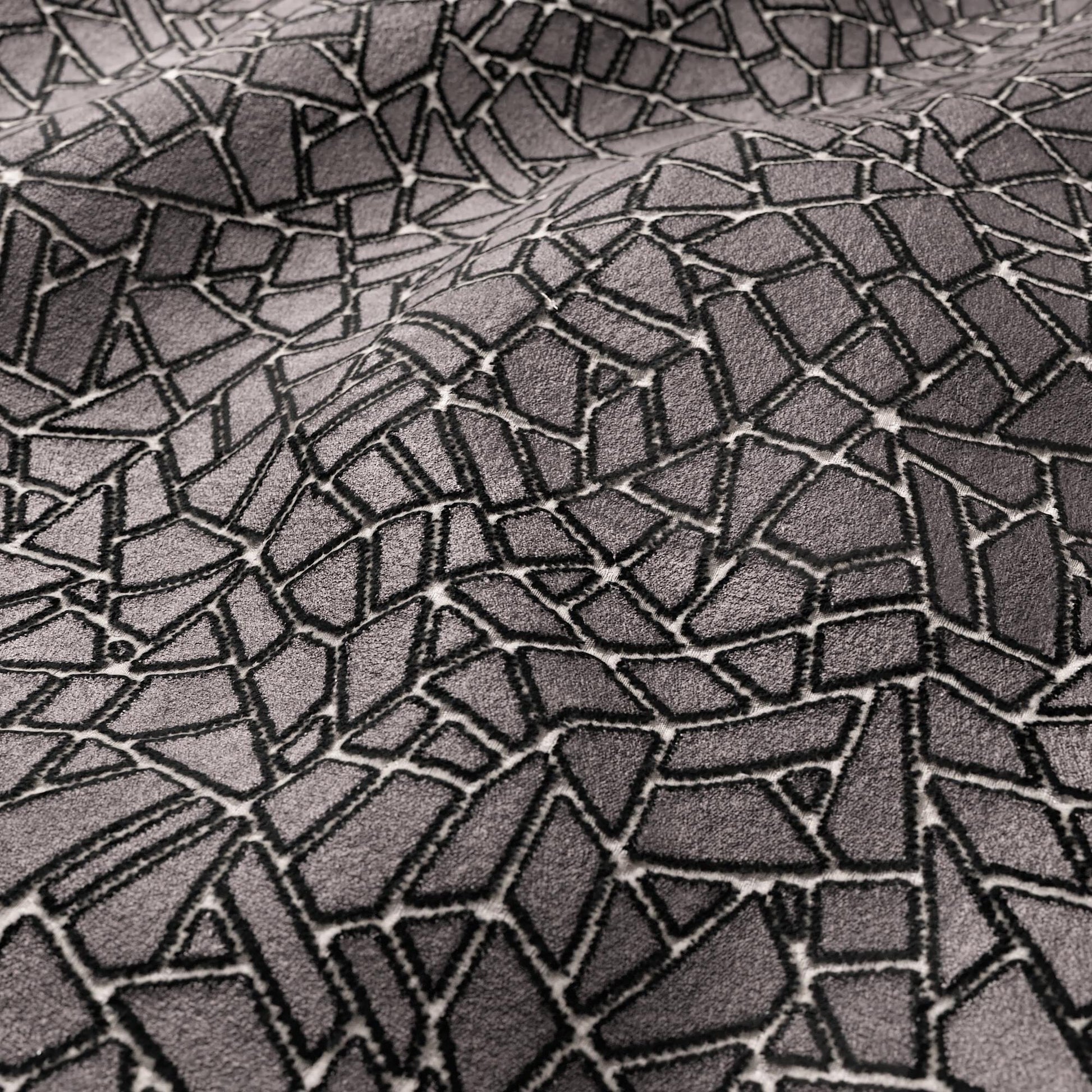 Grey velvet fabric with an irregular polygon mosaic crackle pattern; modern geometric texture.