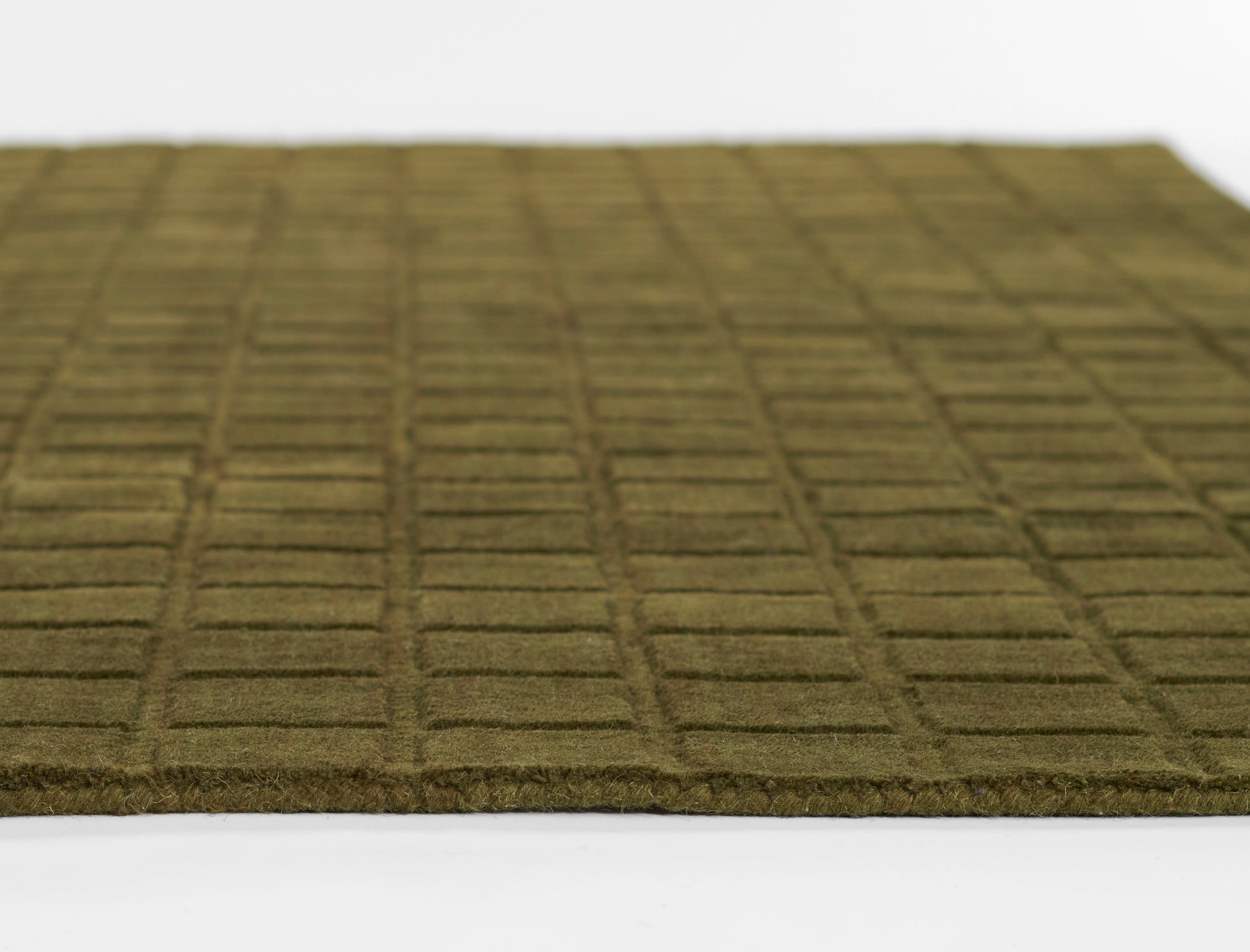 Olive-green doormat with raised square grid pattern and textured fibrous surface.