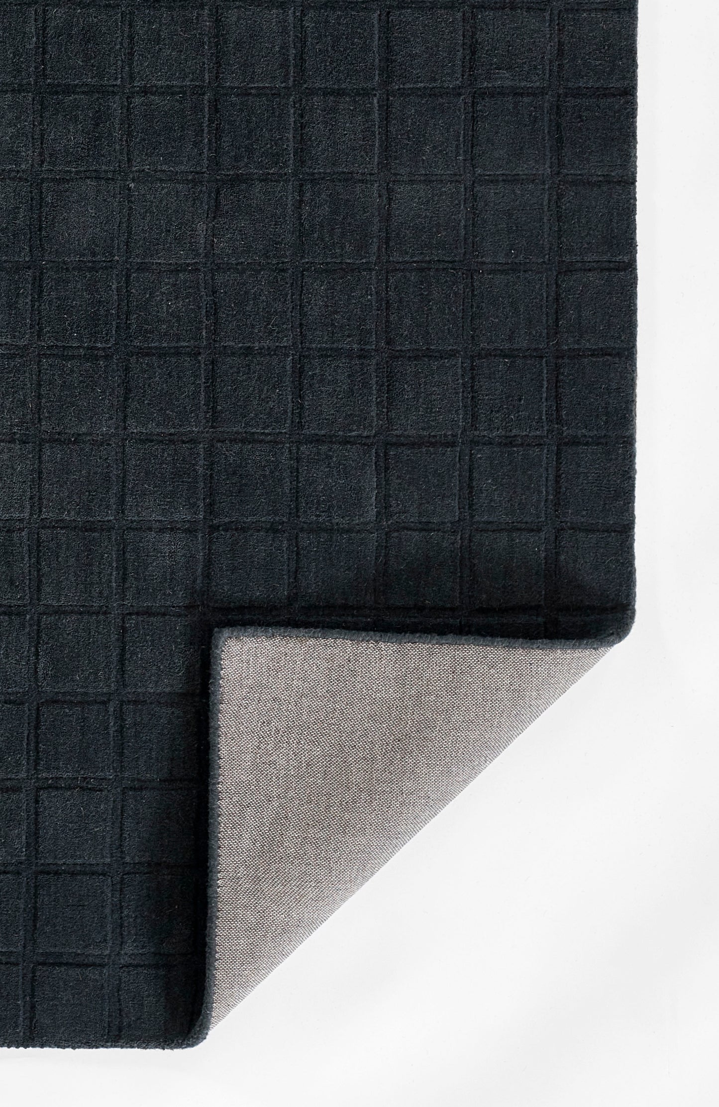 Navy grid-textured textile with light gray backing, folded at corner.