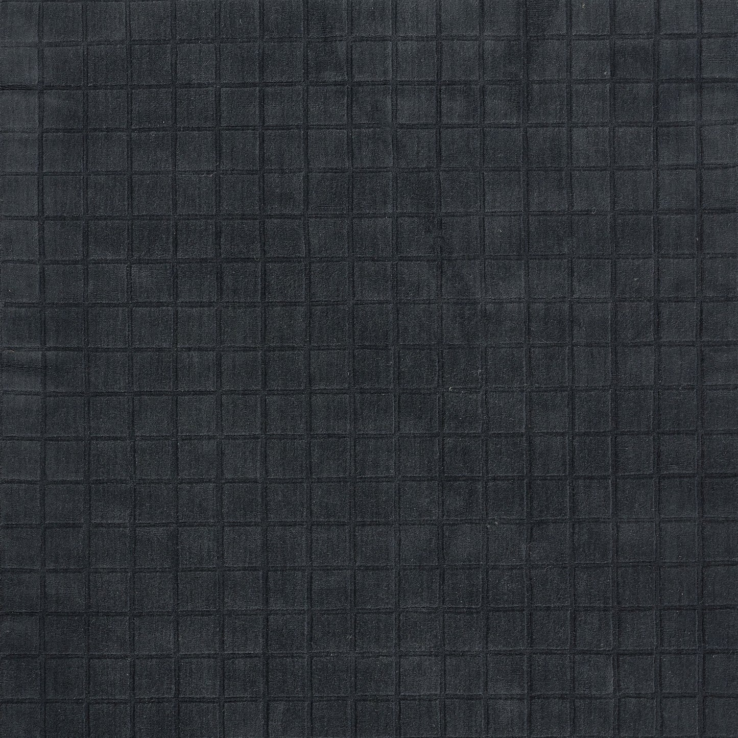 Dark navy quilted fabric with subtle square grid stitching; versatile for bags or upholstery.