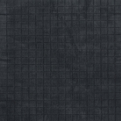 Dark navy quilted rug with a subtle square grid texture.