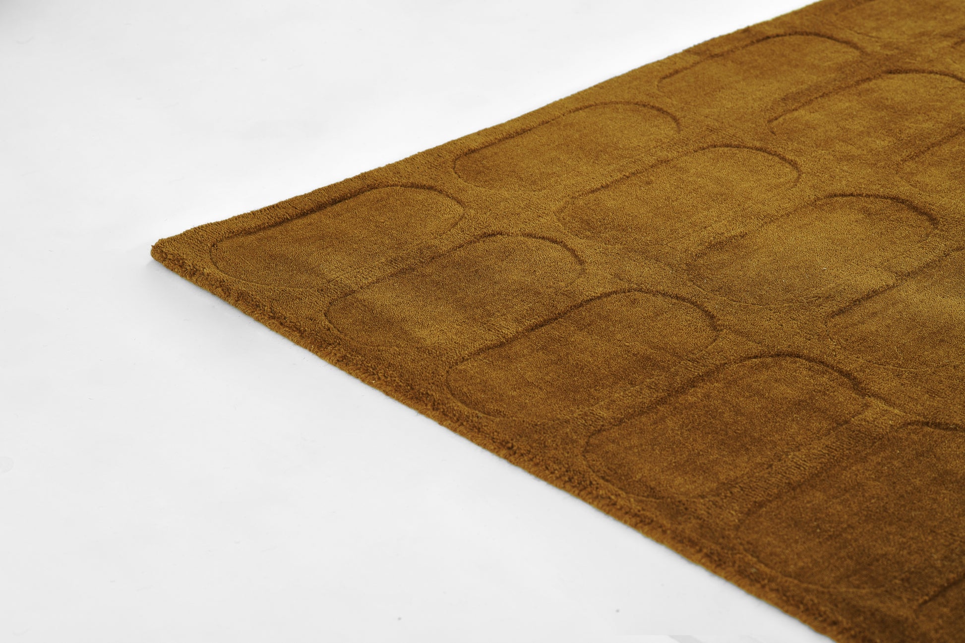 Brown rectangular bath mat with a tufted rounded-rectangle grid; soft microfiber surface for bathroom use.
