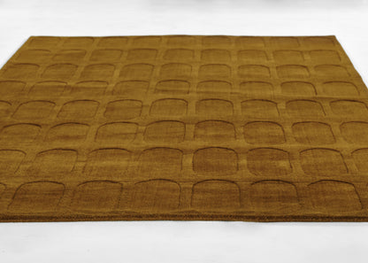Brown rug with a repeating rounded-rectangle embossed grid; soft plush pile and modern geometric floor mat.