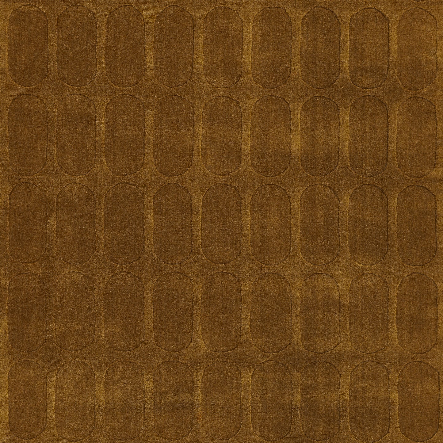 Brown rug with a grid of repeating rounded-rectangle oval motifs and a rustic textured finish.