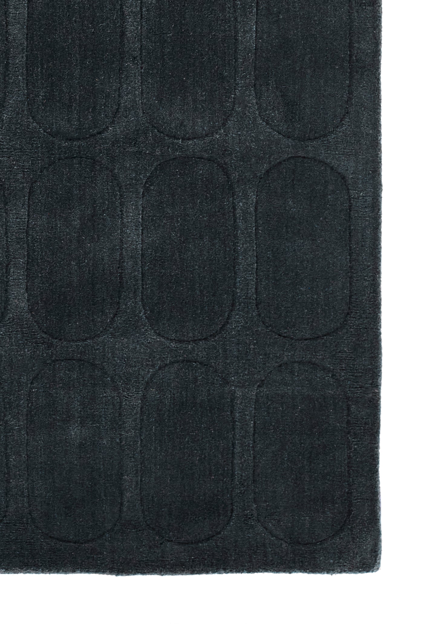 Navy Contocon bath mat with soft microfiber pile and embossed rounded-rectangle grid pattern.