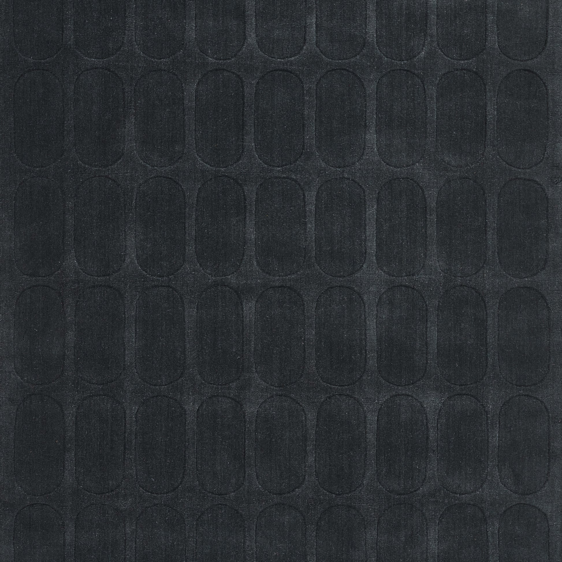 Dark charcoal textured rug runner with a repeating rounded-oval grid pattern; 2'3" x 8'.