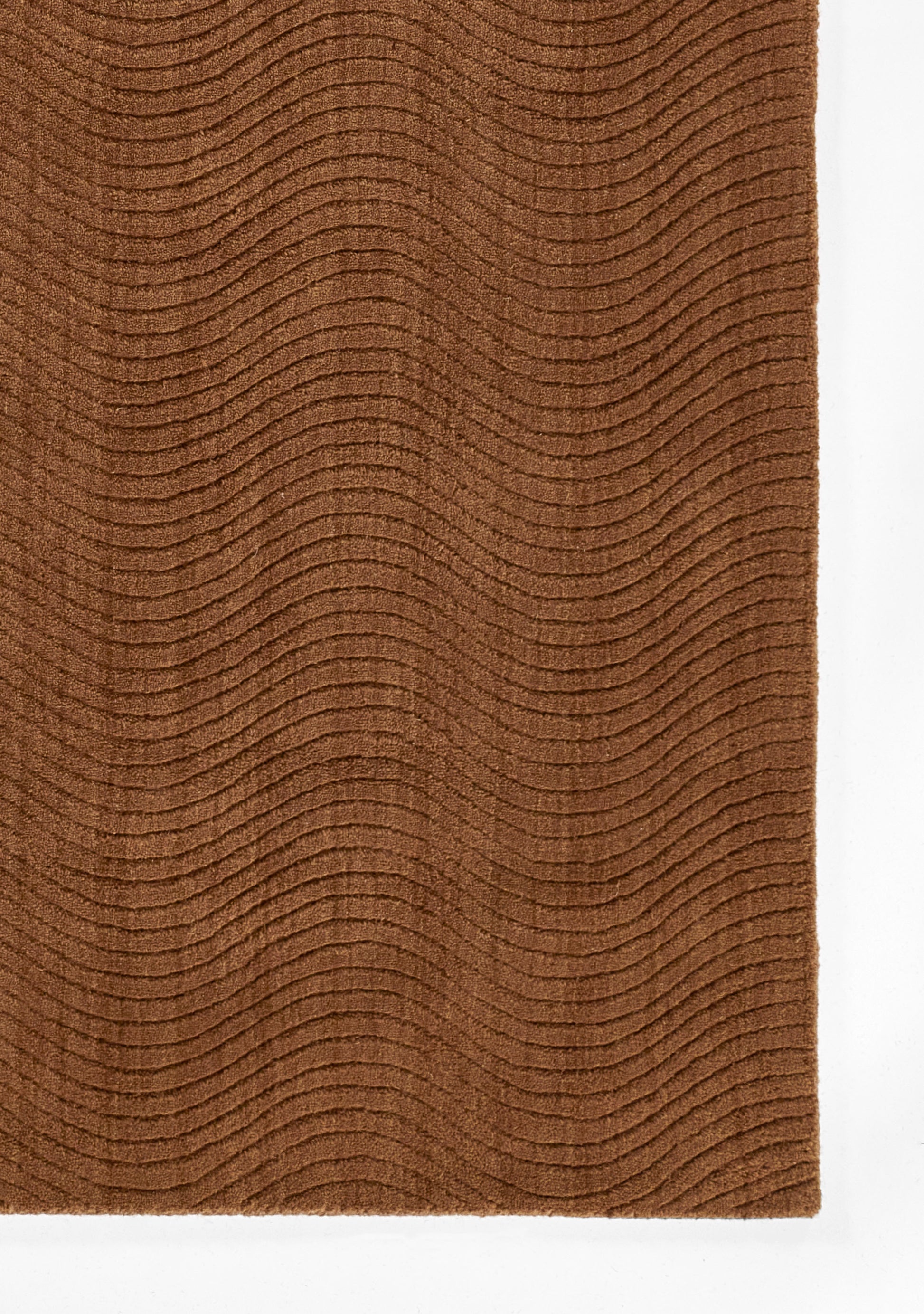 Rust brown rug with subtle curved wave pattern and soft textured surface.