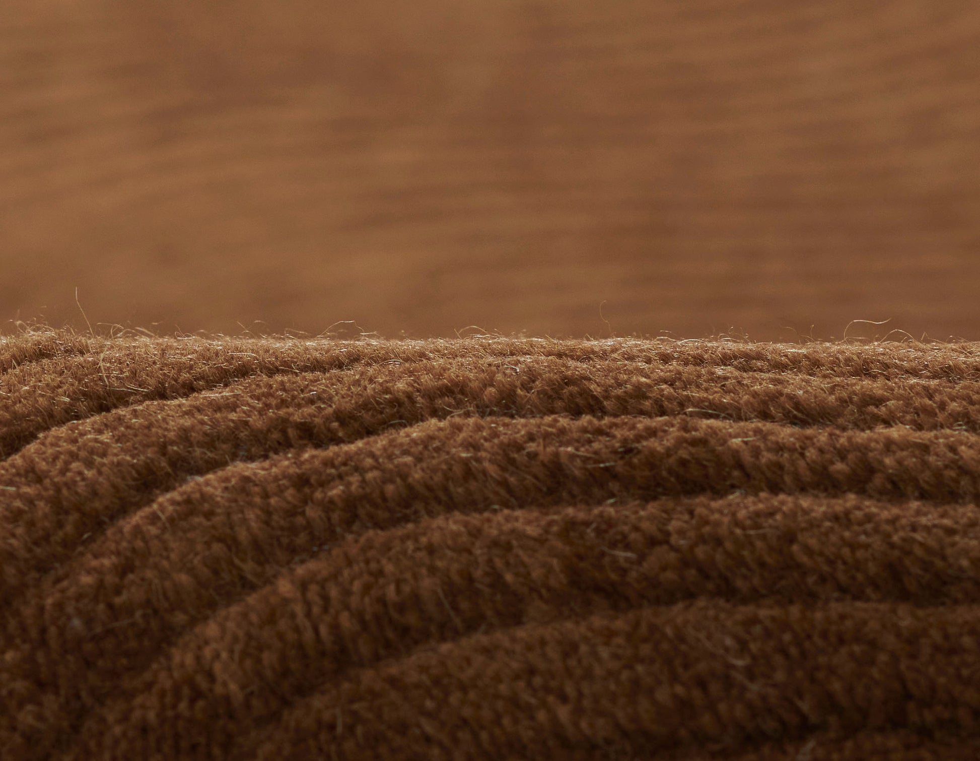 Brown rug runner with plush, dense pile and subtle ribbed folds for cozy warmth, size 2'3" x 8'.