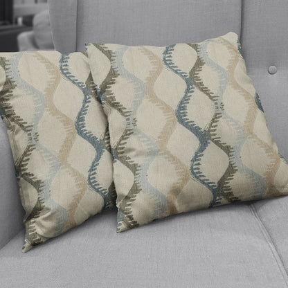 Two square fabric swatches with beige, blue and sage wavy teardrop geometric pattern.