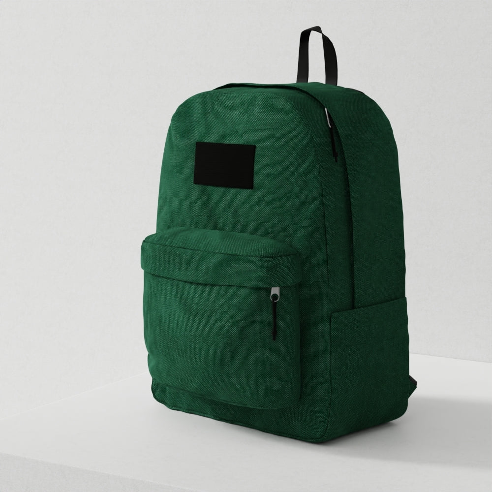Green corduroy backpack with front zip pocket, black label patch, top handle and side pocket; ideal for school or everyday use.