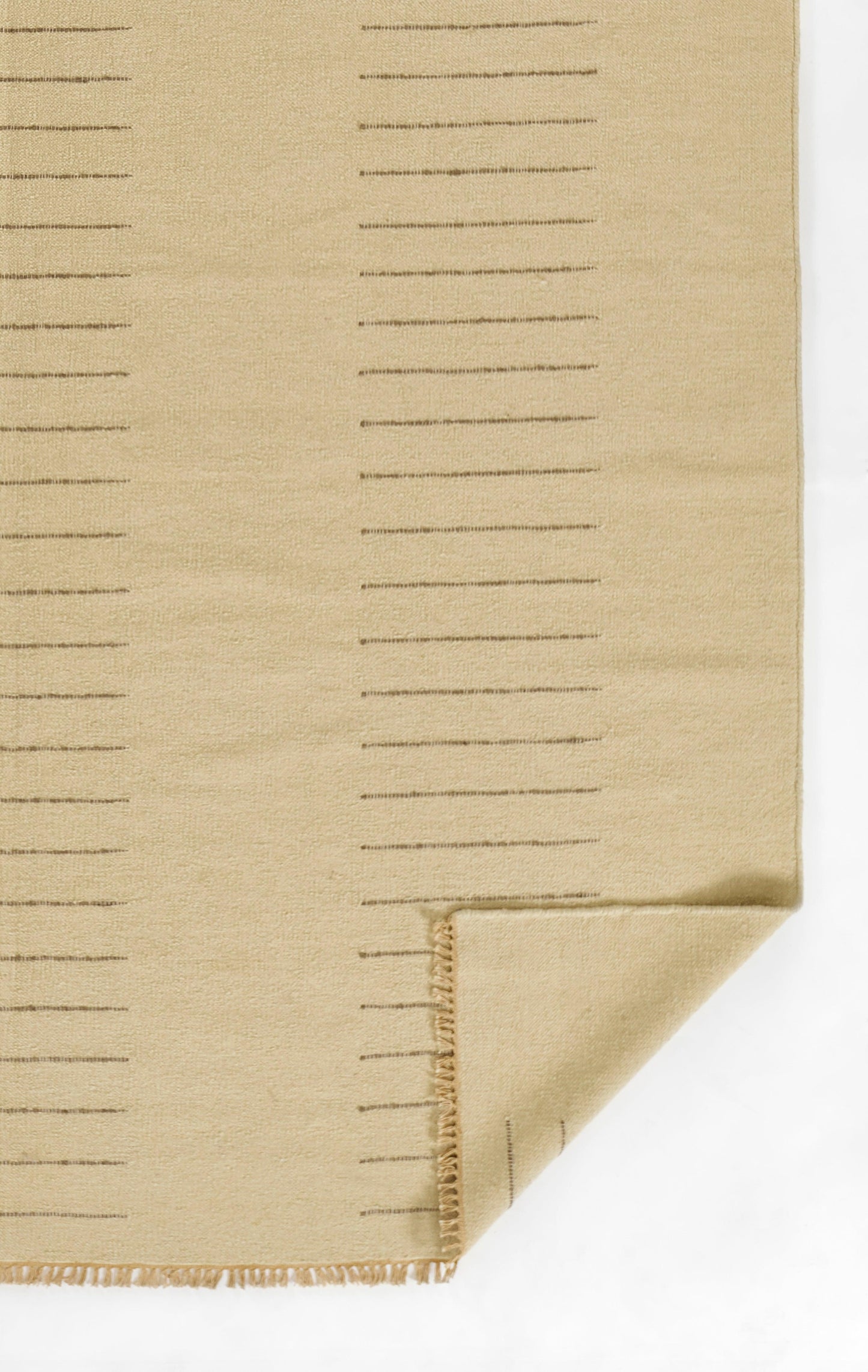 Beige woven fabric swatch with evenly spaced ruler-style lines and folded stitched corner.