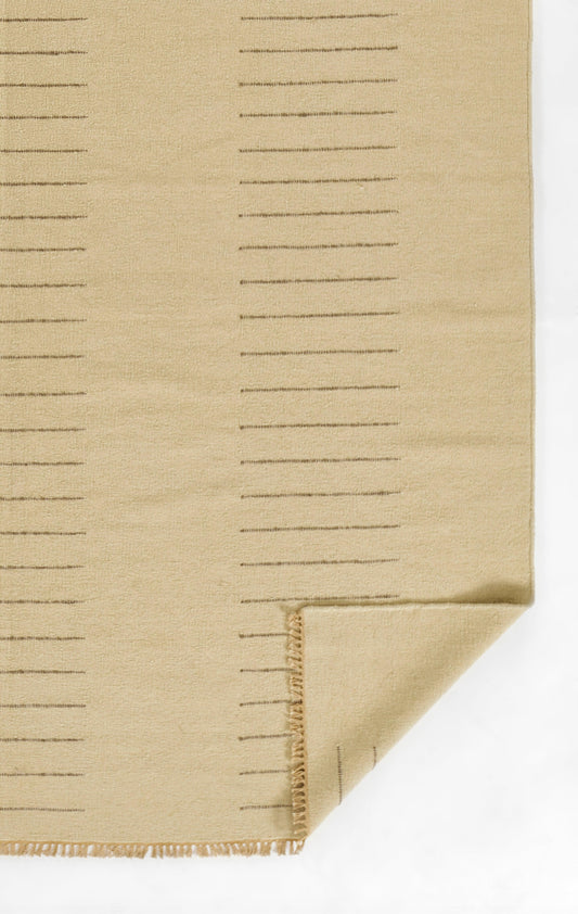 Beige woven fabric swatch with evenly spaced ruler-style lines and folded stitched corner.
