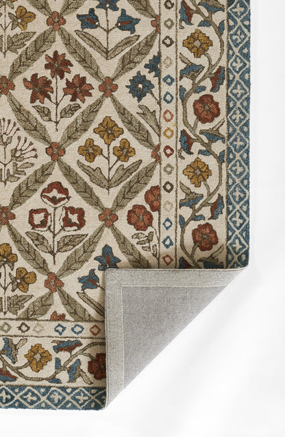 Ornate floral-pattern rug in beige with red, blue and olive flowers; blue border; folded corner reveals backside.