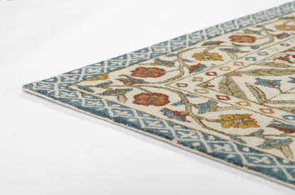 Blue-bordered wool rug with cream field and rust/blue floral vines in a Persian-inspired motif.