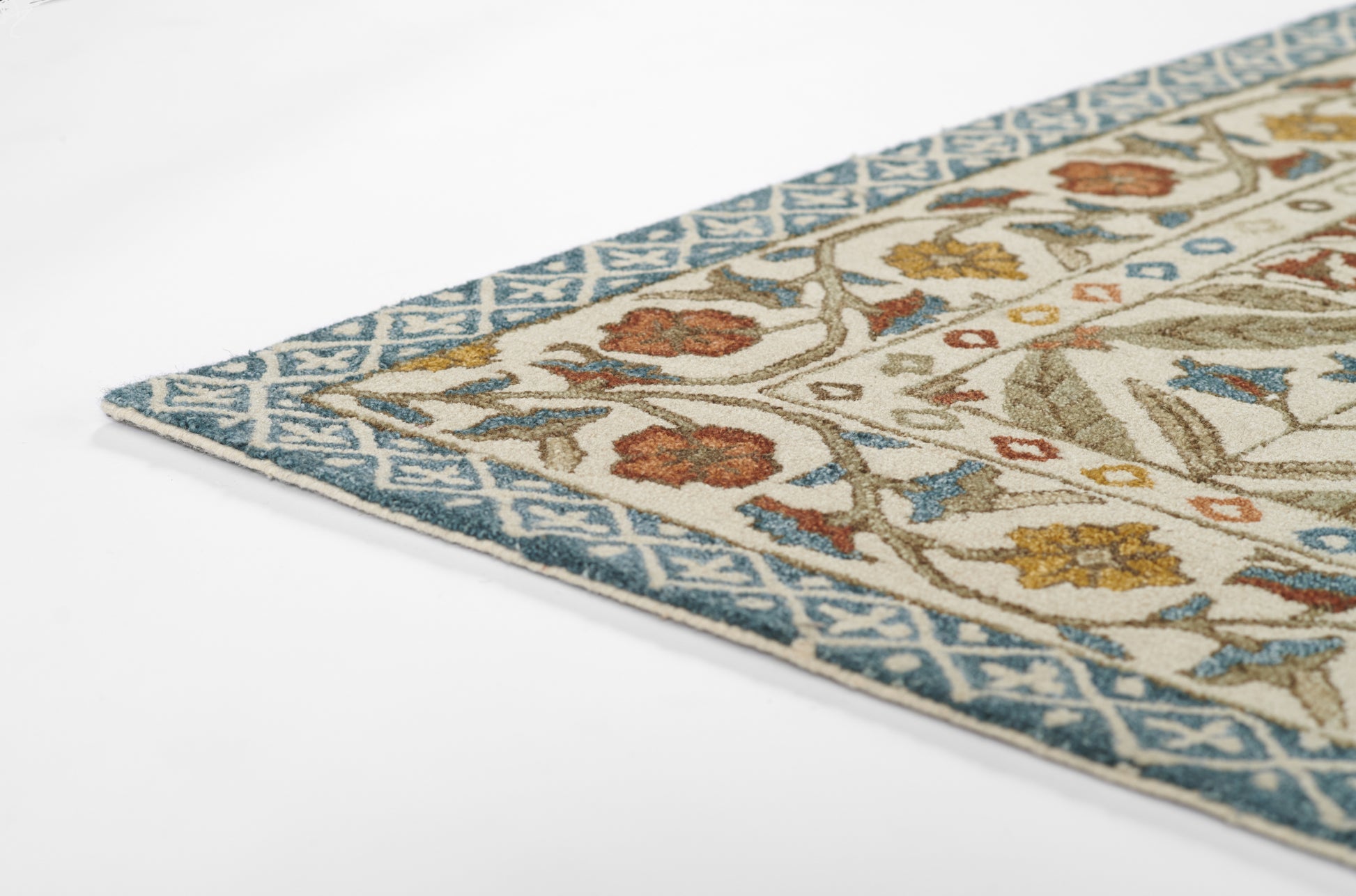 Blue bordered area rug with beige field and multicolor floral motif; decorative oriental-style rug.